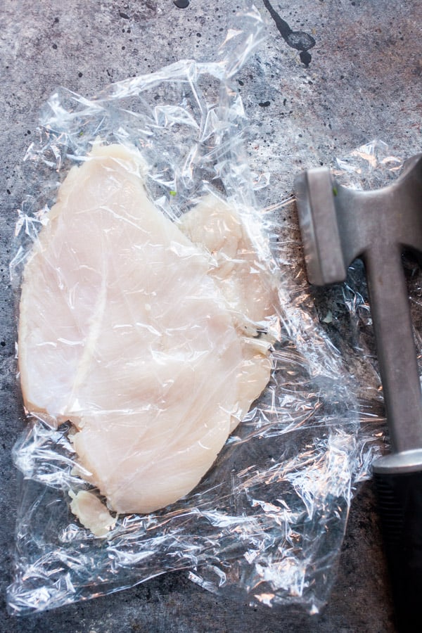 Pounding chicken flat for Chicken Rollatini