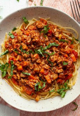 This turkey ragu has all the flavors of a traditional Bolognese sauce, but is fast to simmer together. It's a classic Italian comfort food option! macheesmo.com #turkey #ragu