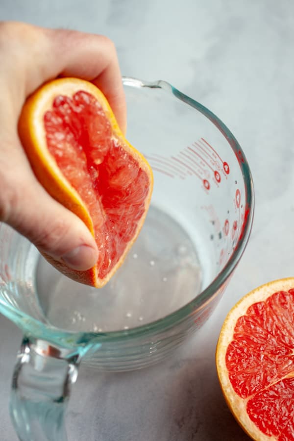 Squeezing a fresh grapefruit