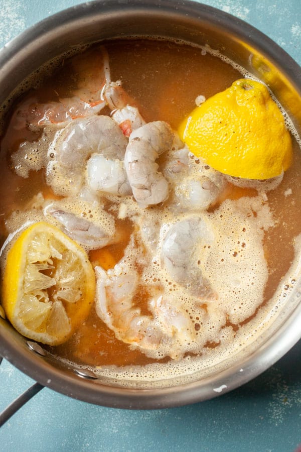 Poaching shrimp with old bay and lemon.