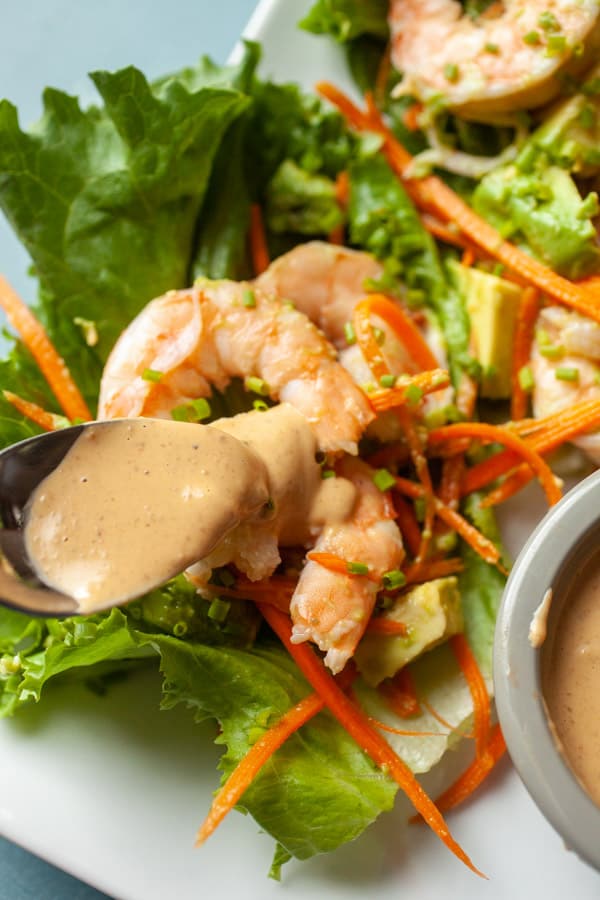 Spicy peanut sauce on shrimp lettuce wraps.