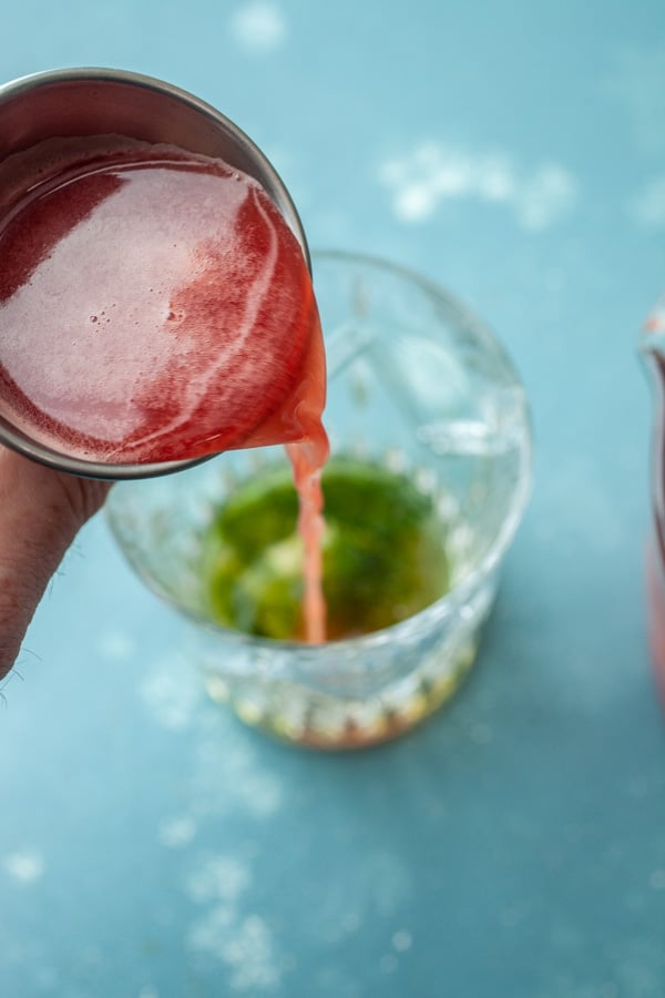 Adding juice - Making Watermelon Bourbon Cocktail