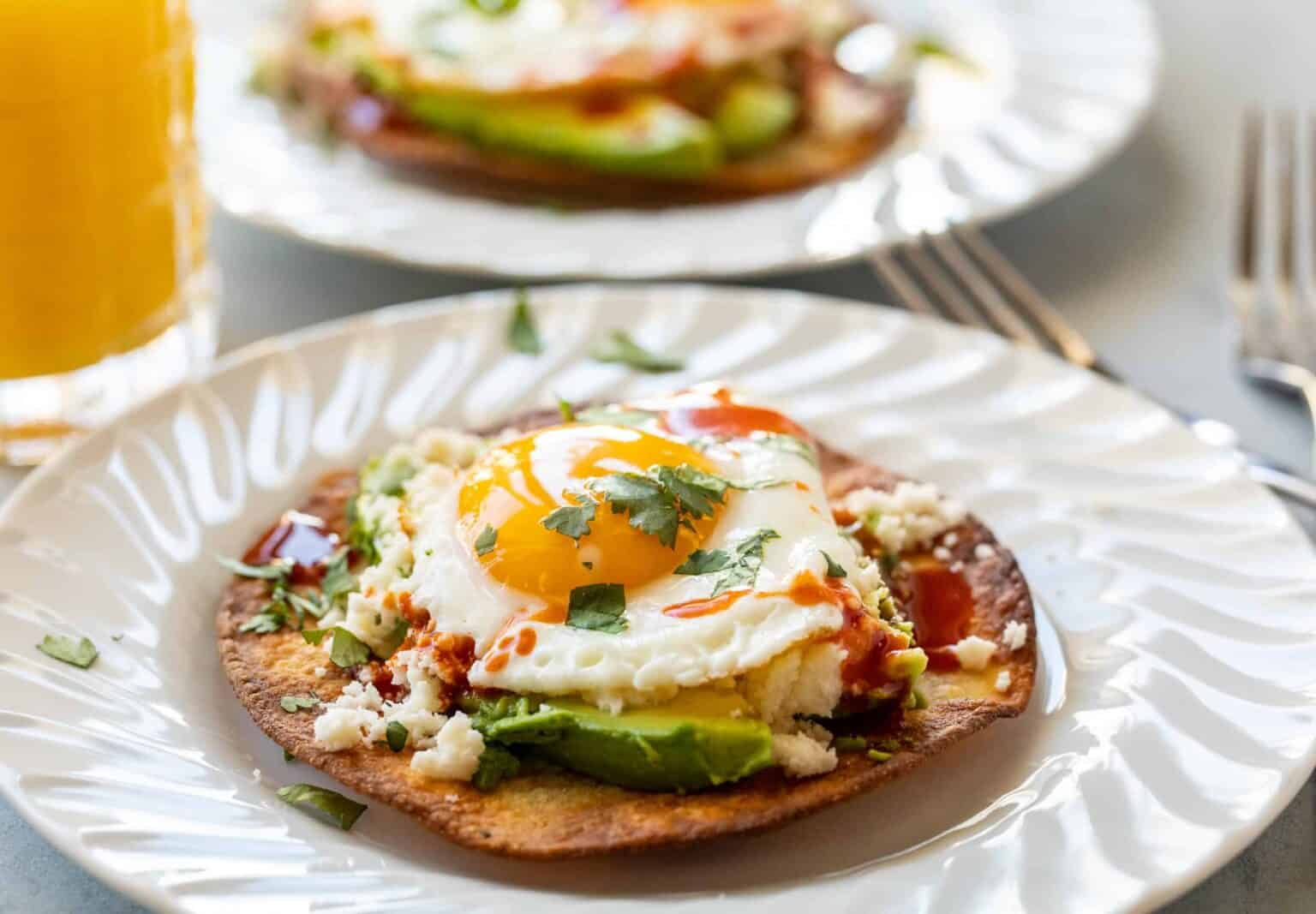 Avocado egg tostada crispy corn tortilla for quick impressive savory breakfast