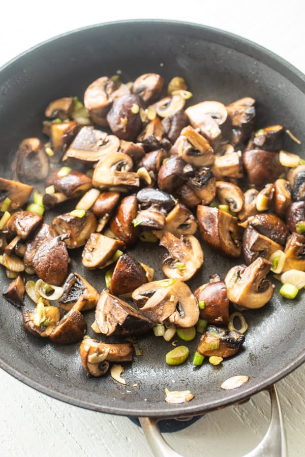 Sauteed mushrooms in a skillet for flatbreads