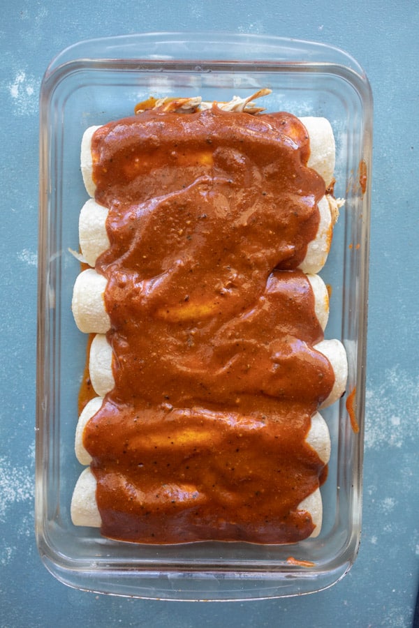 Sauce added to enchiladas