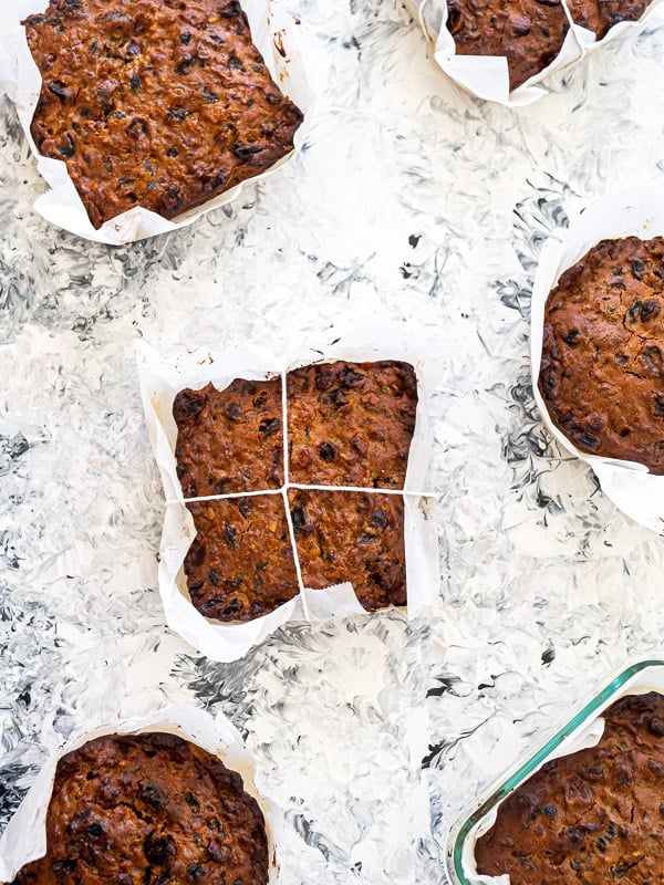 6 fruitcakes wrapped in parchment paper 