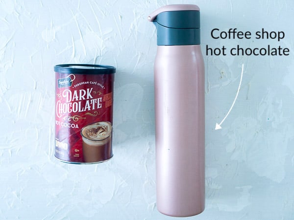 A side-by-side comparison of store-bought hot cocoa and a vacuum flask with hot chocolate