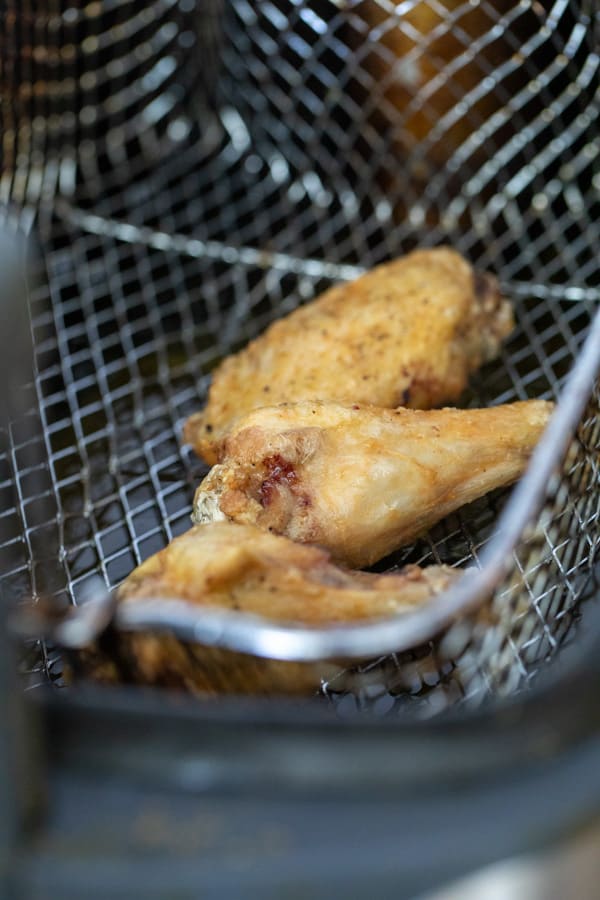 Frying the wings and ready for the sauce.