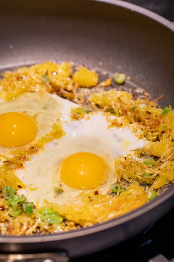 Eggs cracked in for breakfast skillet!