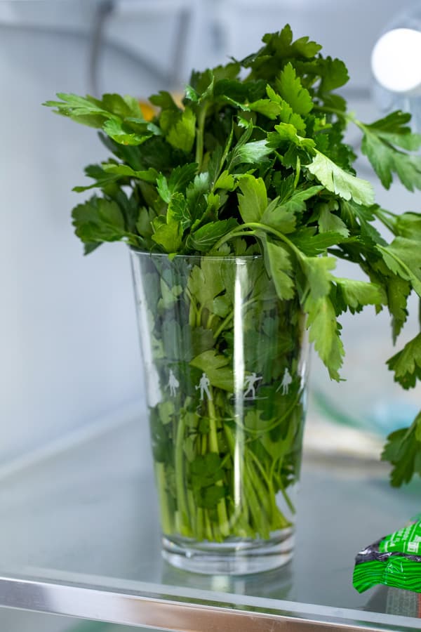 Herbs in a pint glass with water