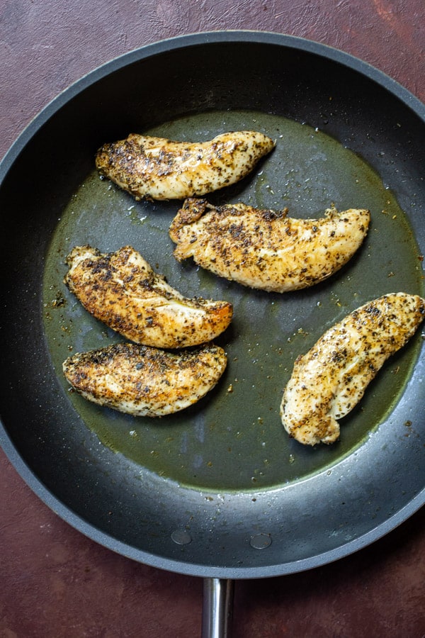 Cooked chicken in a skillet.