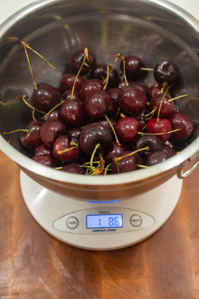 Weighing cherries for the compote.