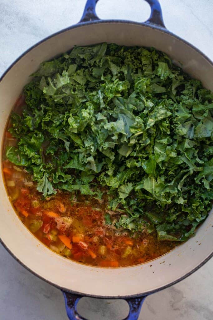 Kale added to the soup at the end of cooking.