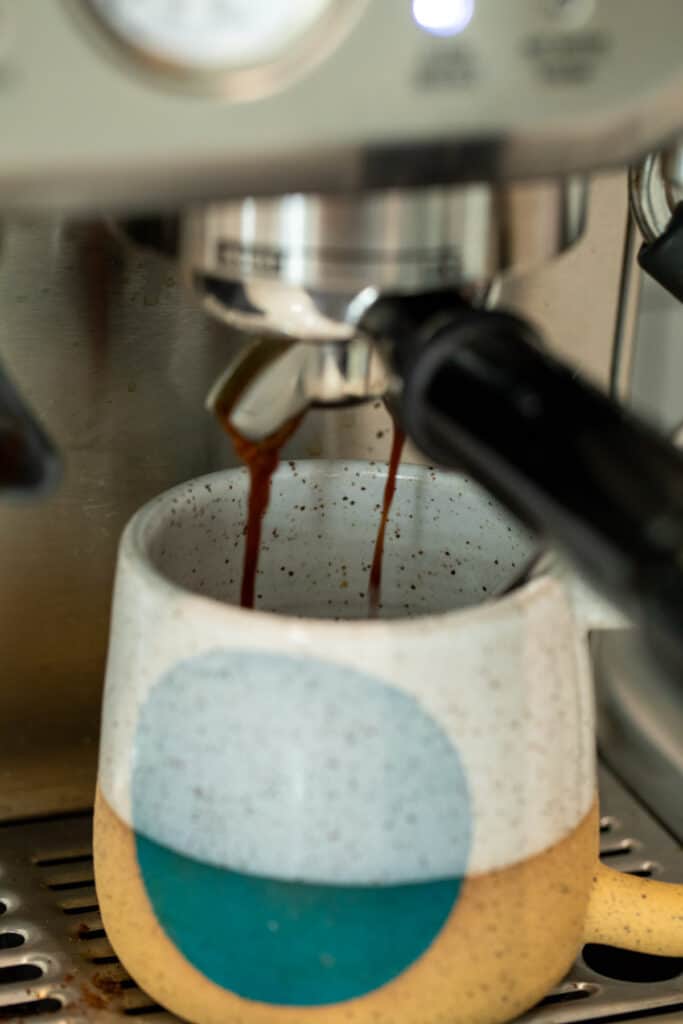 Making espresso for pumpkin spice latte.
