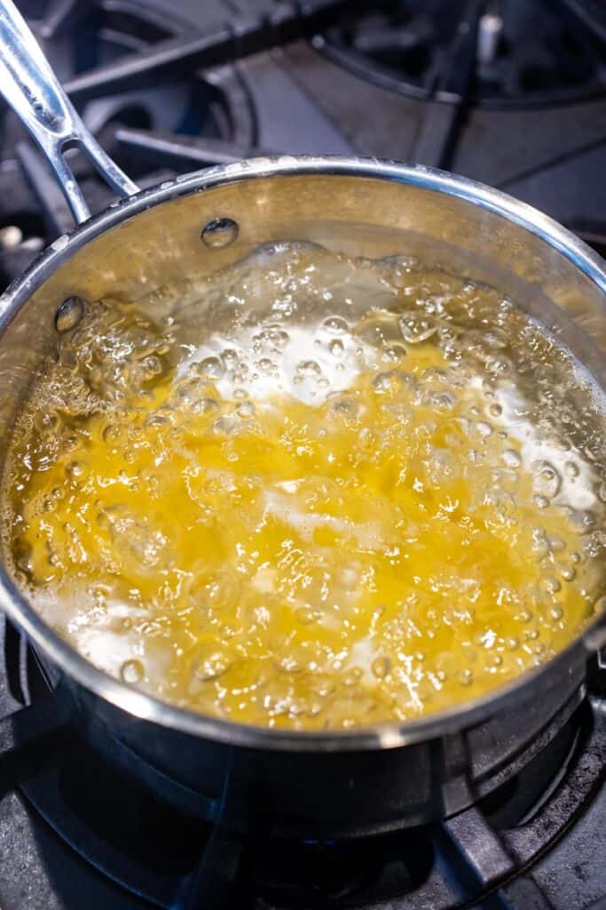 Cooking rigatoni pasta.