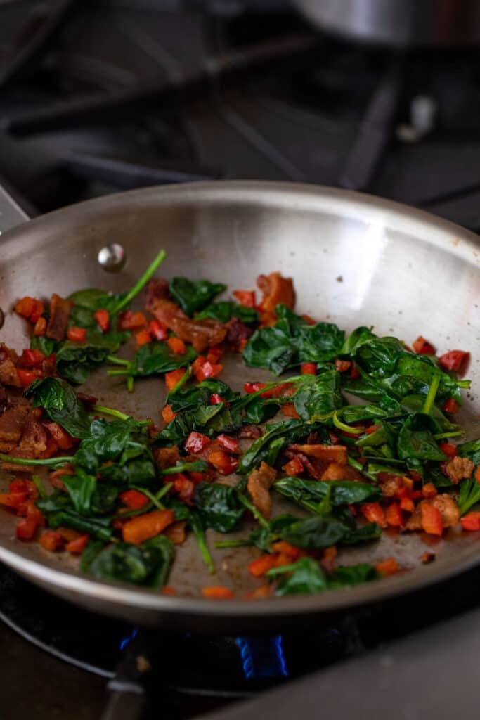 Cooking vegetables for breakfast tortilla.