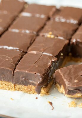 Traditional fudge can be tricky project, but these Easy Fudge Bars are fast to make and have a creamy texture that holds its shape thanks to a peanut crust.