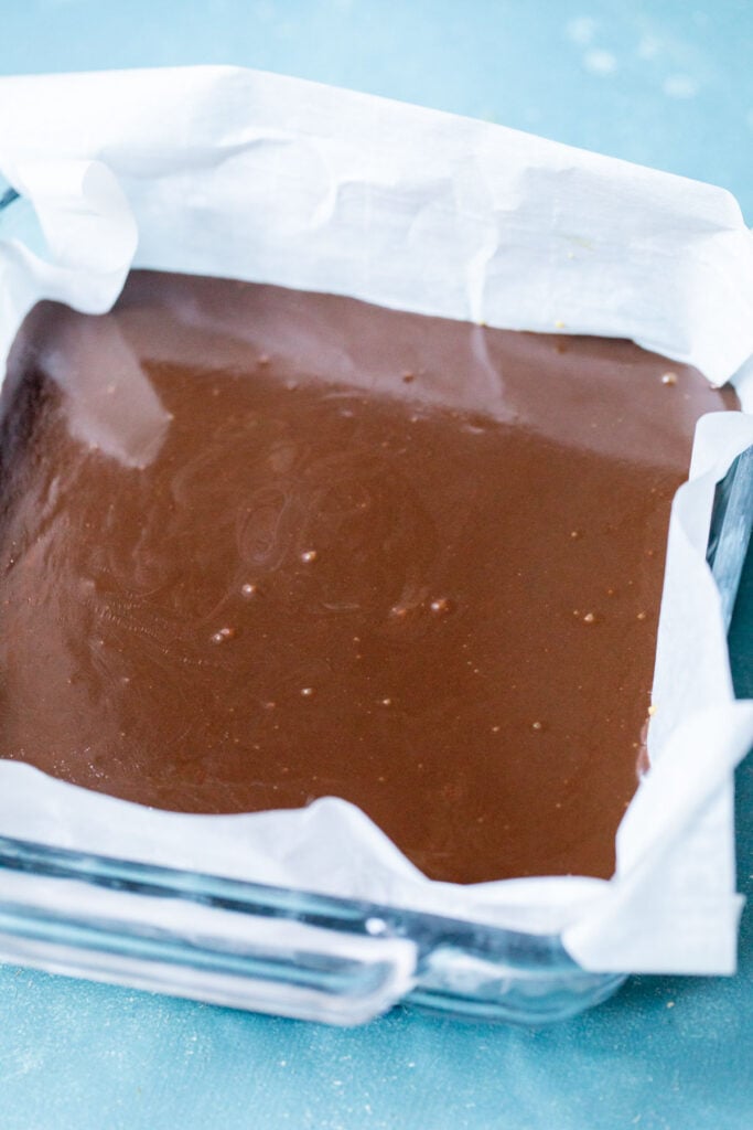 Pour fudge layer into the pan.