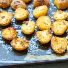 New potatoes tossed with a rosemary garlic butter sauce and roasted. These crispy Rosemary Potatoes are the perfect side dish for any meal.