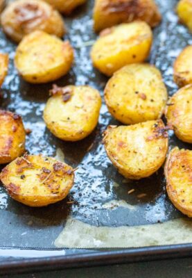 New potatoes tossed with a rosemary garlic butter sauce and roasted. These crispy Rosemary Potatoes are the perfect side dish for any meal.