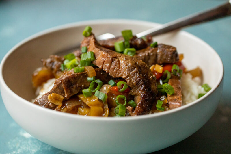 Slow Cooker Flank Steak and Peppers - Deliciously Seasoned
