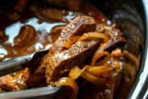 This slow cooker pepper steak is about as easy as dinner can get. Toss the ingredients in your cooker and come back to a delicious dinner!