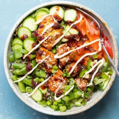 Spicy Salmon Bowls with toppings.l