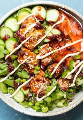 Spicy Salmon Bowls with toppings.l
