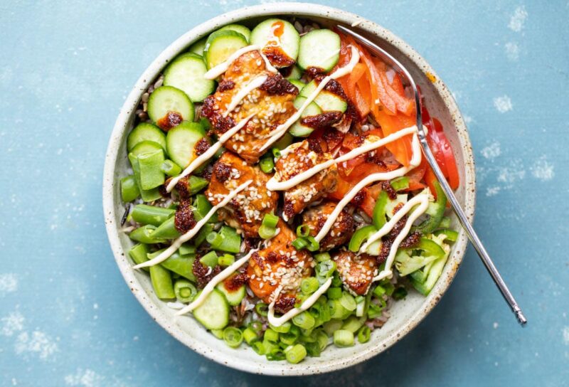 Spicy Salmon Bowls with toppings.l