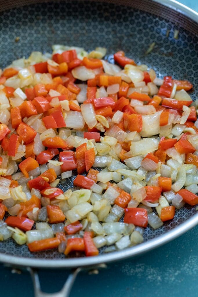Veggies softened in a skillet.