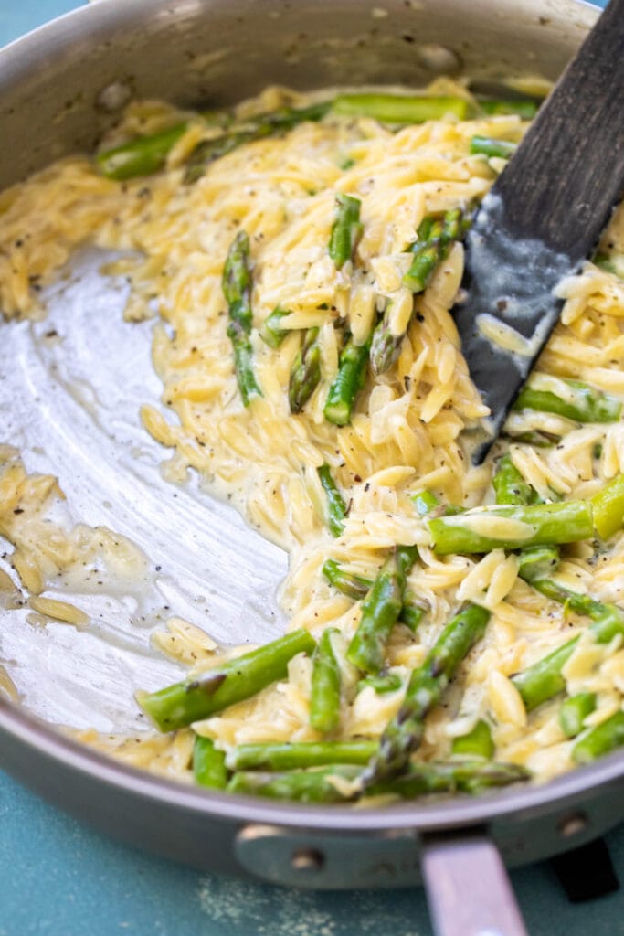Creamy orzo in a skillet.