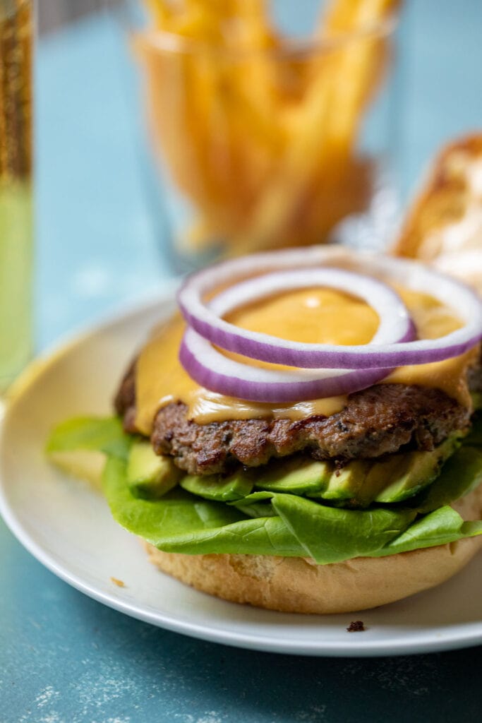 Turkey smash burger with toppings.