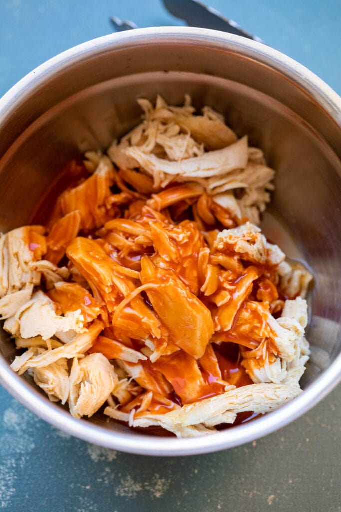 Making the buffalo chicken.