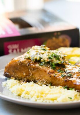 Grilled Salmon with Chimichurri Butter on a couscous.