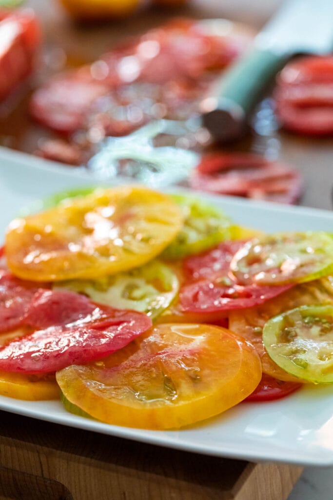 Assembling the tomato layers for the crudo.