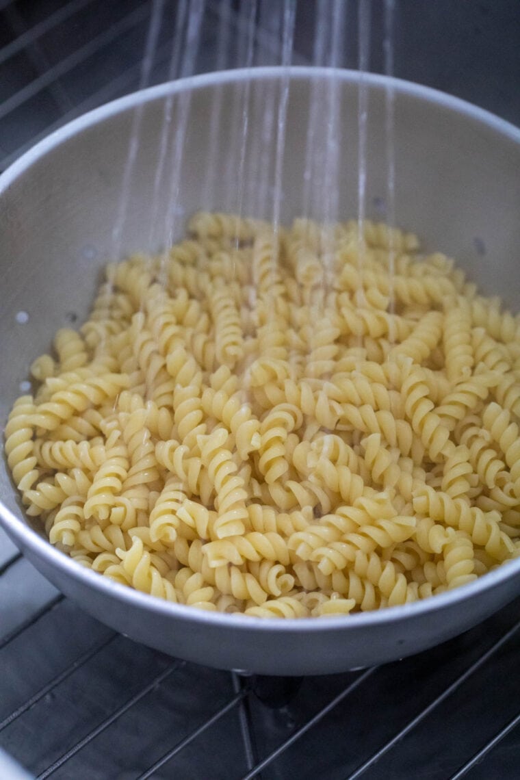 Rinsing pasta for salad.
