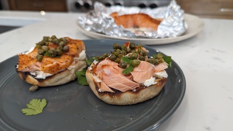 Smoked salmon on muffin with cream cheese.