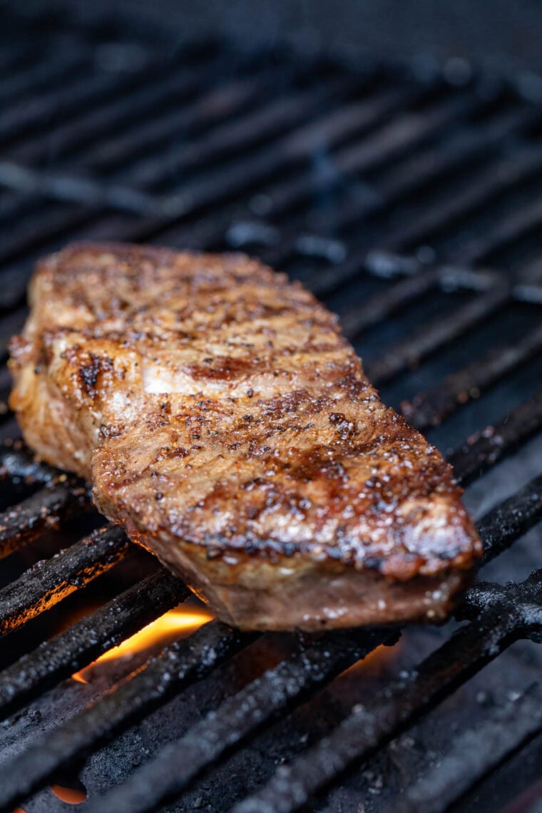 Grilling steaks for wraps.