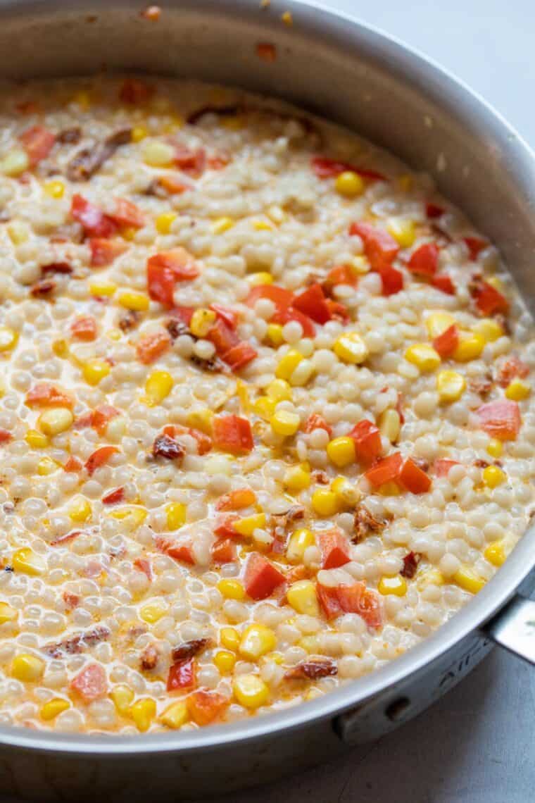 Finishing couscous with cream.