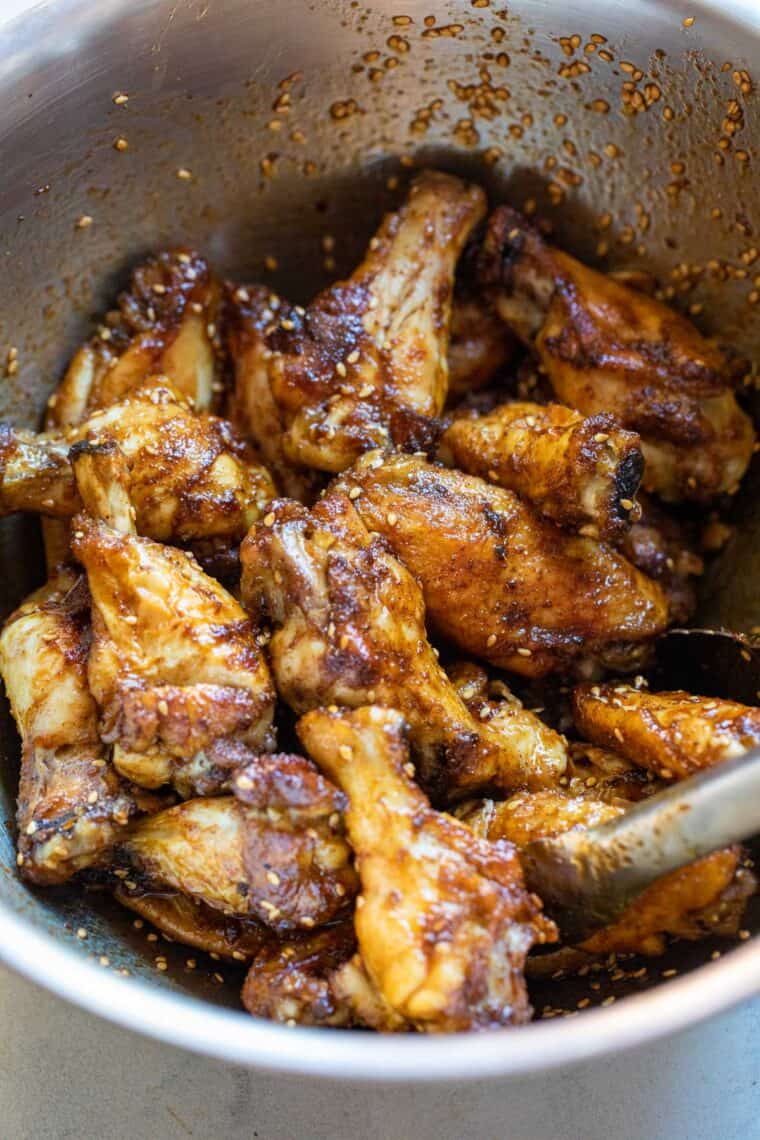 Wings tossed in sauce.