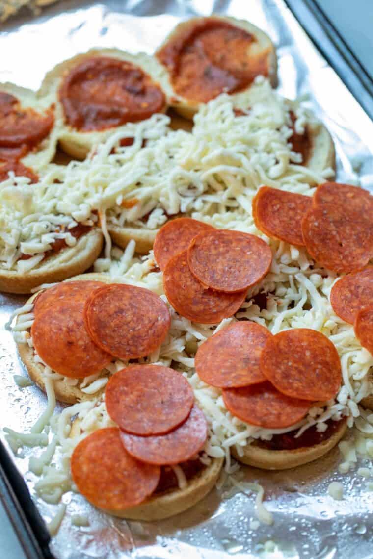 Assembling the pepperoni pizza sliders.